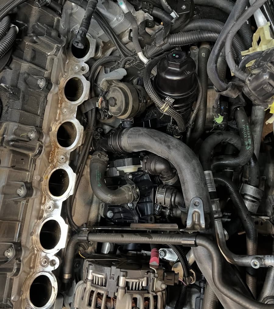 Engine bay pipework and hose routing during a repair