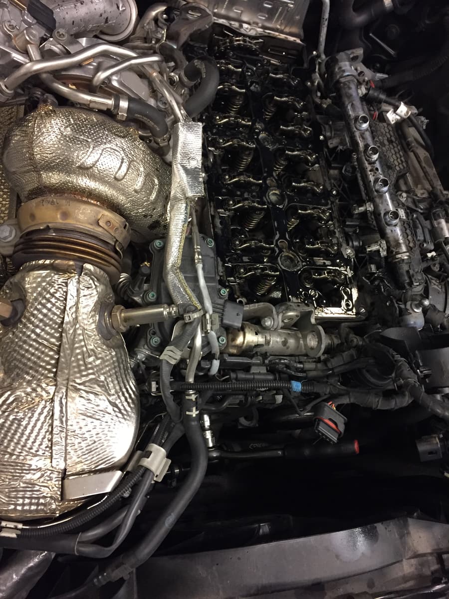 Engine bay with the valve cover removed for diagnostics